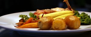 Bacon-wrapped chicken with fresh seasonal vegetables at Godswell Park Luxury Care Home, Oxfordshire